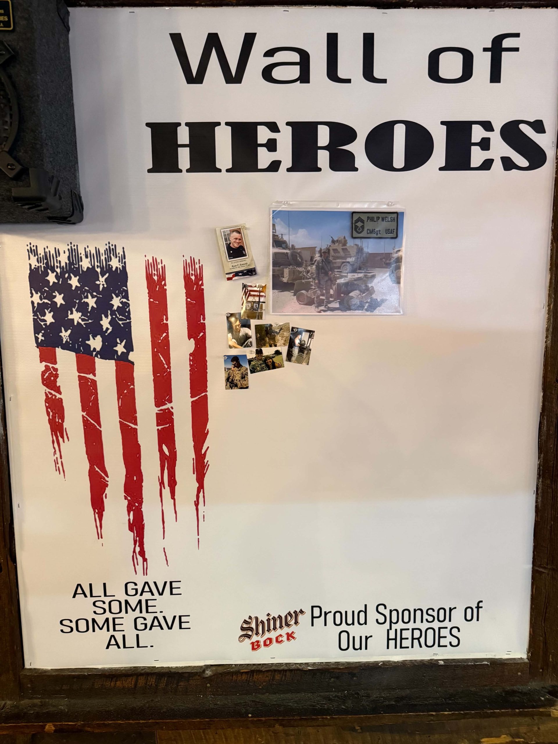 Wall of Heroes at The Pit BBQ honoring loved ones who made the ultimate sacrifice
