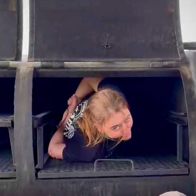 Kristin inside Tilly, The Pit BBQ's 500-gallon reverse-flow smoker